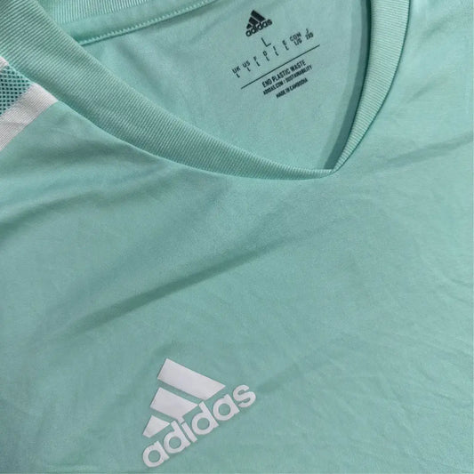 Adidas sports T-shirt in a refreshing mint green with white accents.
