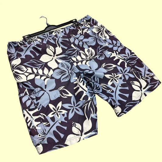 Old Navy ®floral print swim shorts in a tropical Hawaiian-inspired design.