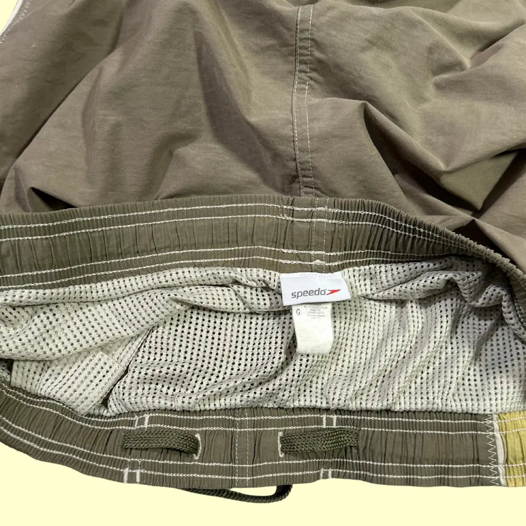 Speedo ®beach-themed swim shorts in olive green with scenic palm tree and ocean print side panels.