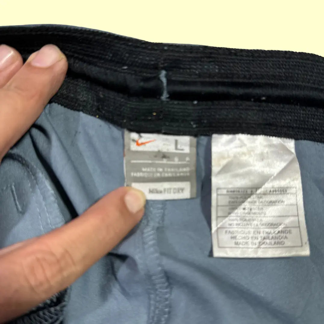 Nike® Dri-FIT training shorts in sleek grey with a subtle blue embroidered swoosh logo.