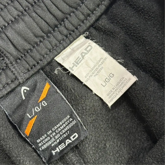 Head black track pants are designed for comfort and style.