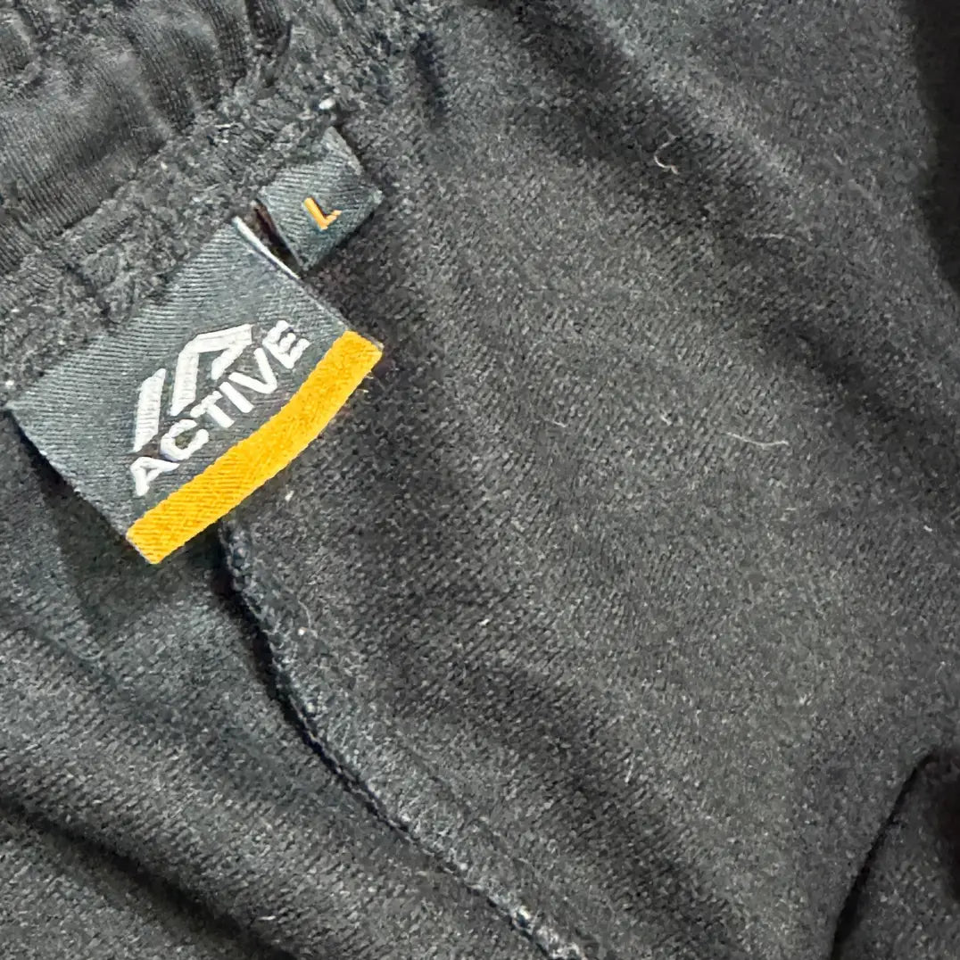 ACTIVE ®black jogging pants with white side stripes are perfect for both activewear and casual outings.