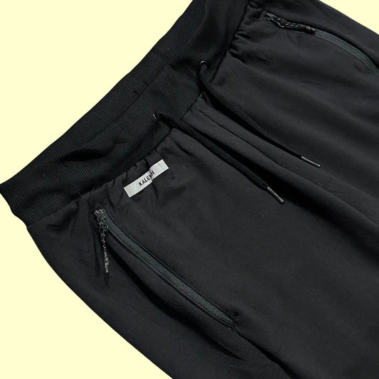 Kalenji track pants in black are perfect for workouts or casual outings