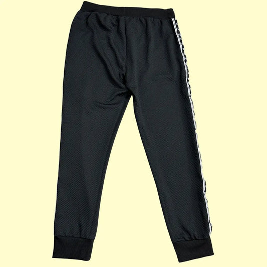 TYPHOON black mesh track pants offer a modern and comfortable design