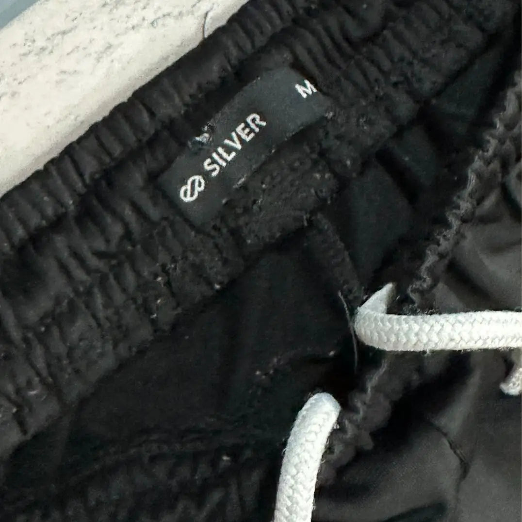 SILVER®black track pants from Silver offer a perfect blend of style and comfort