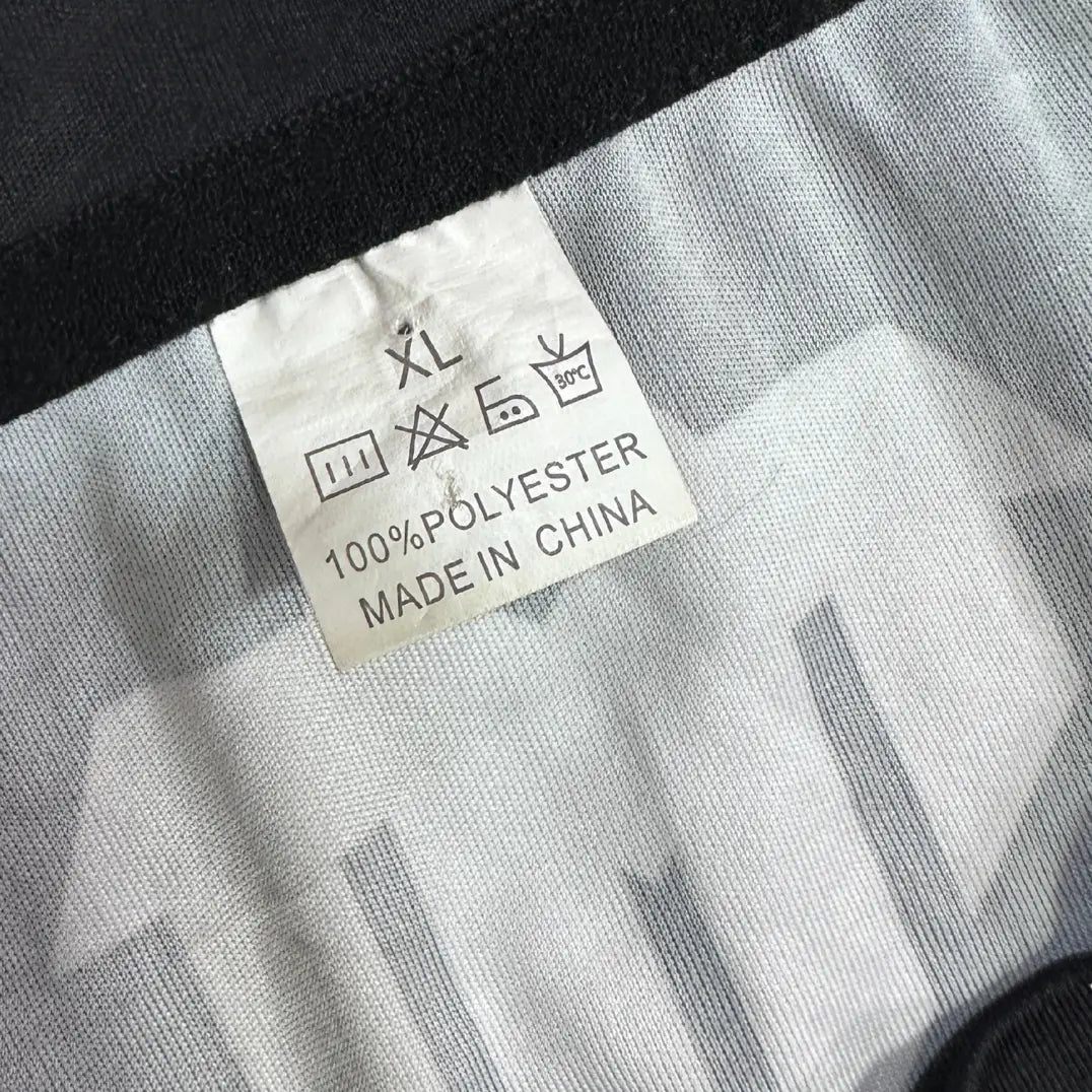 Tiger Muay Thai Training T-shirt in black with bold front tiger logo and Thai script.