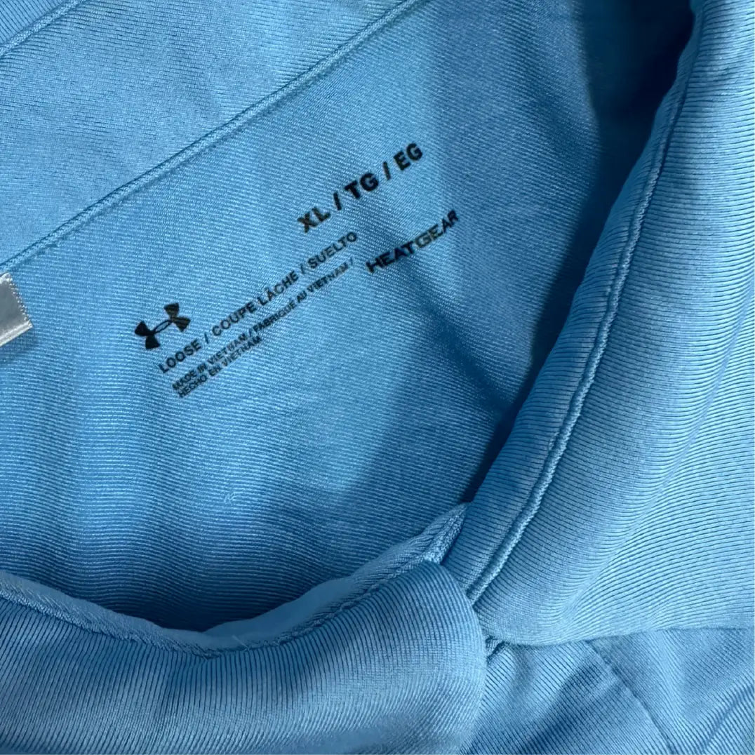 Under Armour HeatGear polo in a light and dark blue striped design