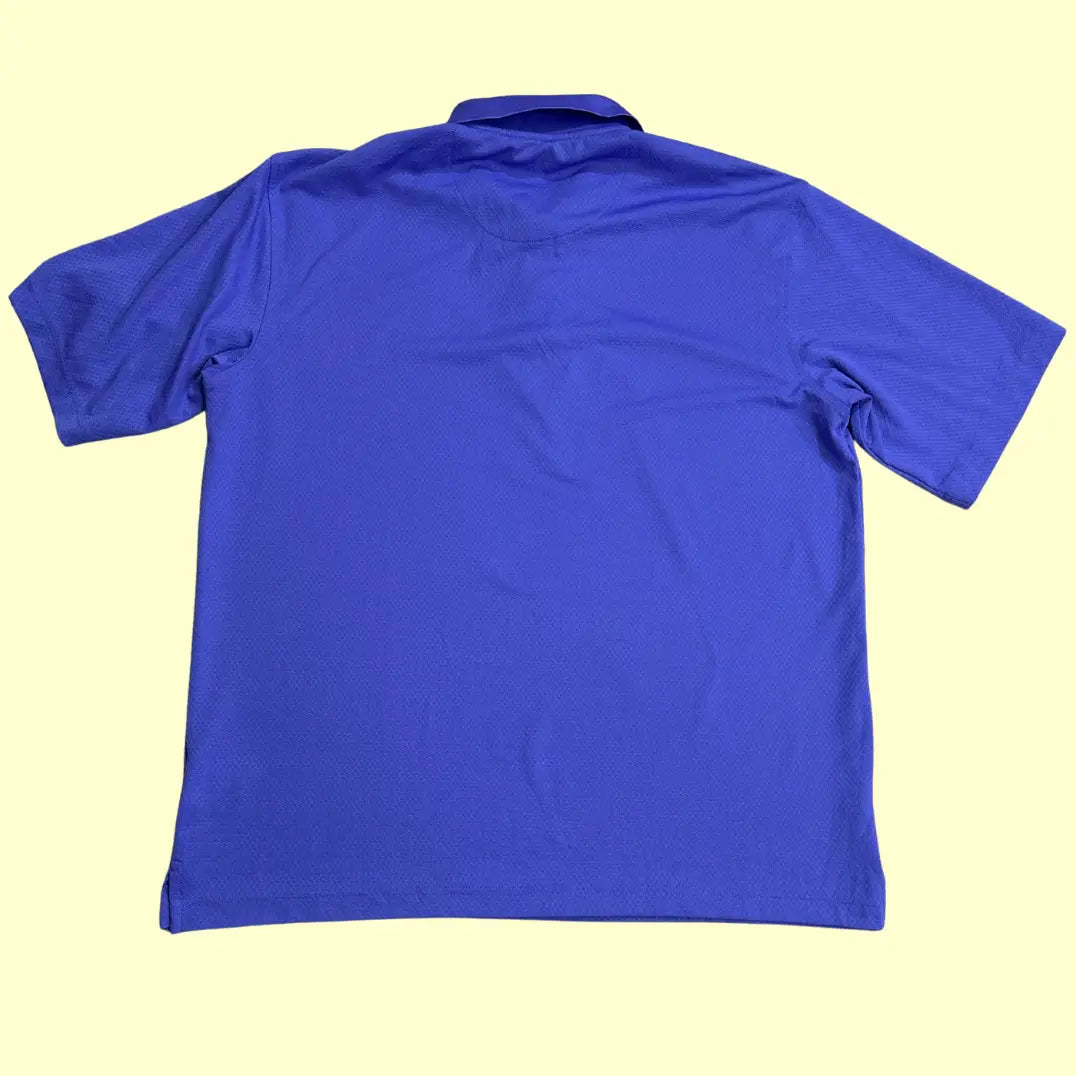 Kirkland Signature Performance Polo Shirt in royal blue.