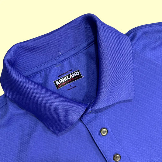 Kirkland Signature Performance Polo Shirt in royal blue.