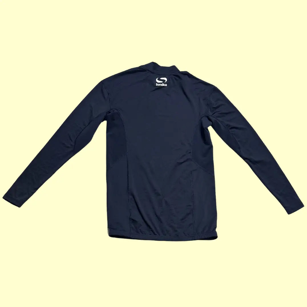 Performance Sondico long-sleeve compression top in black.