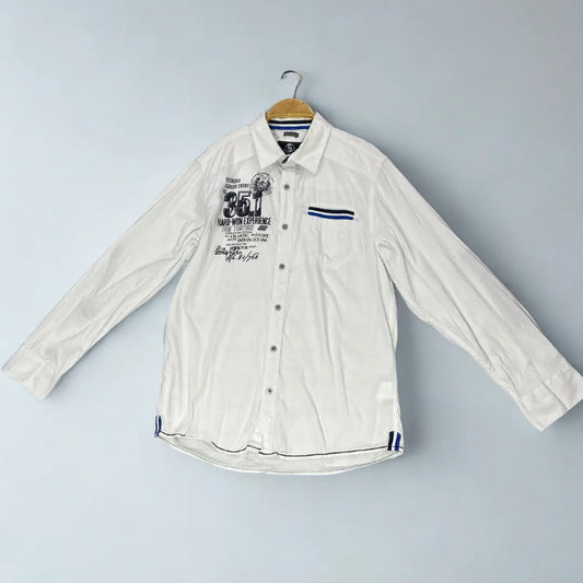 Tom Thompson ®. It comes in a crisp white and is designed to make a statement with its numerous graphic and decorative elements.