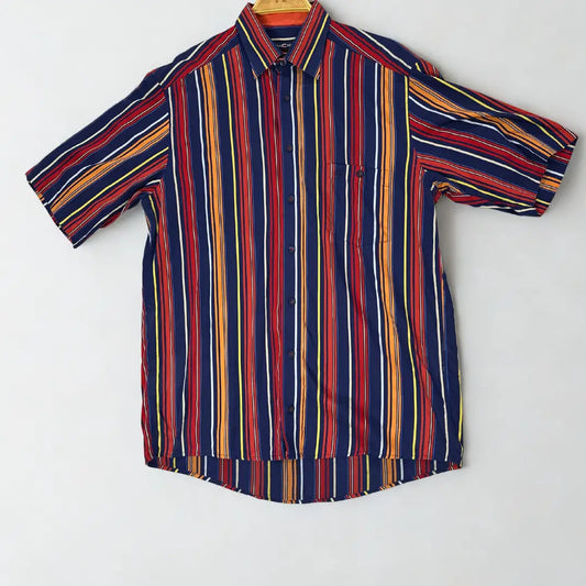 CASA MODA ®. It features a bold, multi-colored vertical stripe pattern in a striking combination of navy blue, red, orange, yellow, and white.