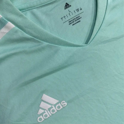 Adidas sports T-shirt in a refreshing mint green with white accents.