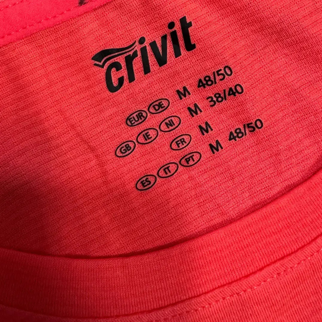 Bright red Crivit active T-shirt with a modern black striped chest panel for a sporty look.