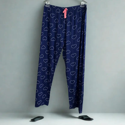 DISNEY® Blue pajama pants with a playful white heart outline pattern all ove