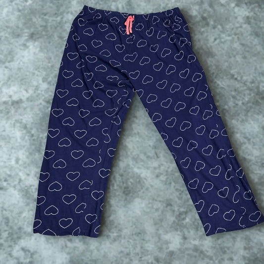 DISNEY® Blue pajama pants with a playful white heart outline pattern all ove