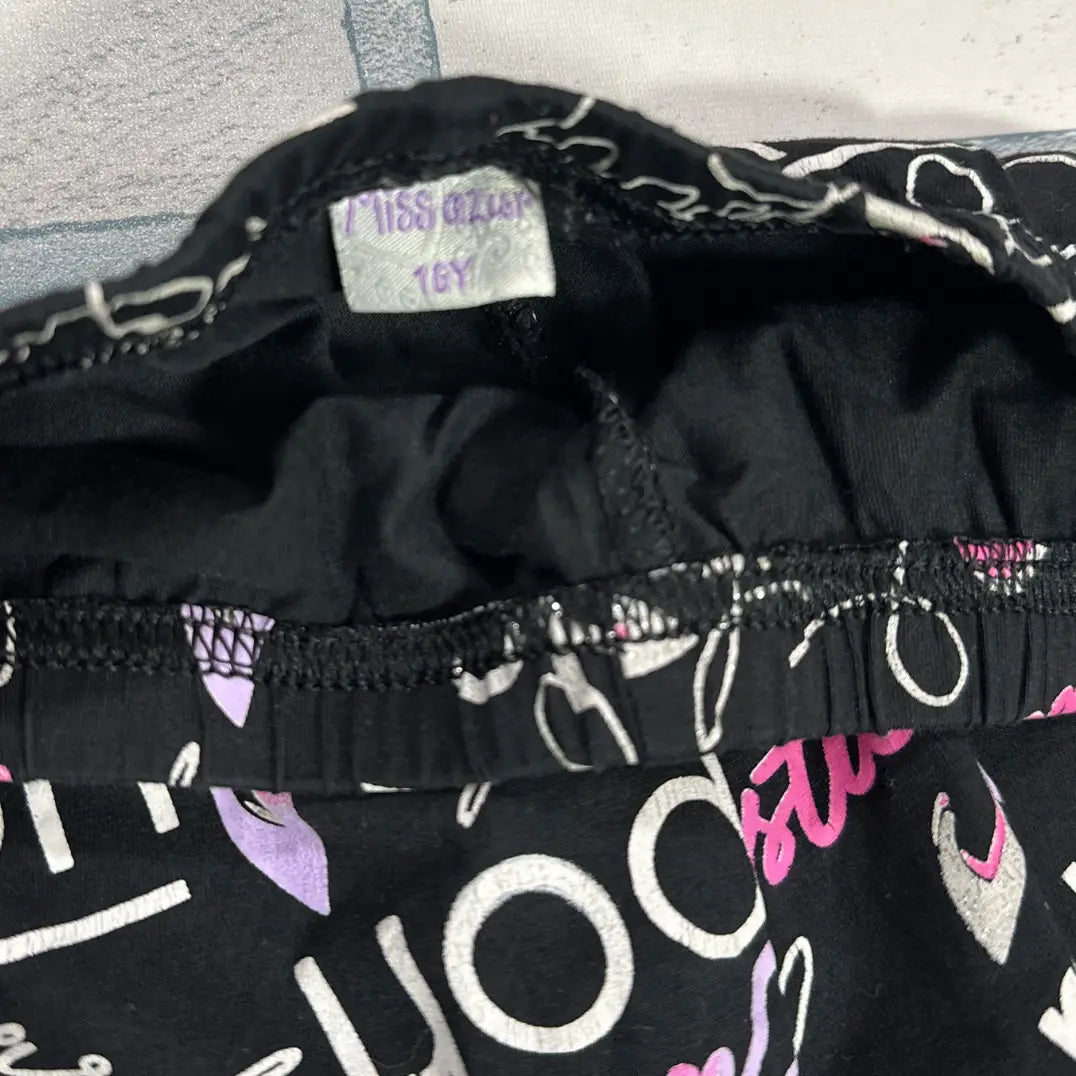 MISS OZIUS® Black leggings covered in playful white and pink text