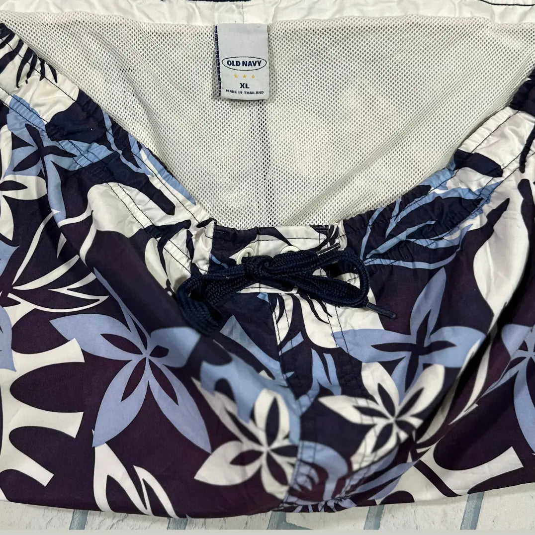 Old Navy ®floral print swim shorts in a tropical Hawaiian-inspired design.