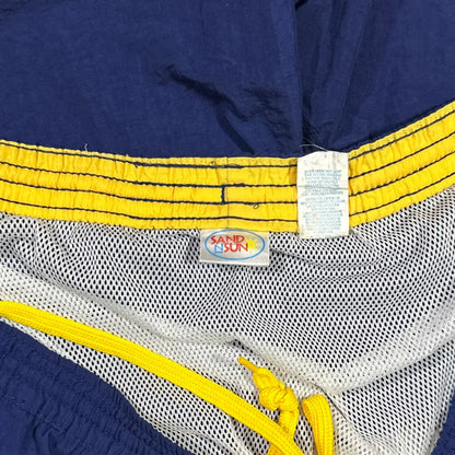 Sand N Sun ®classic swim shorts in solid navy blue with a contrasting yellow elastic waistband and drawstring.