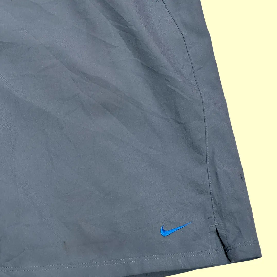 Nike® Dri-FIT training shorts in sleek grey with a subtle blue embroidered swoosh logo.