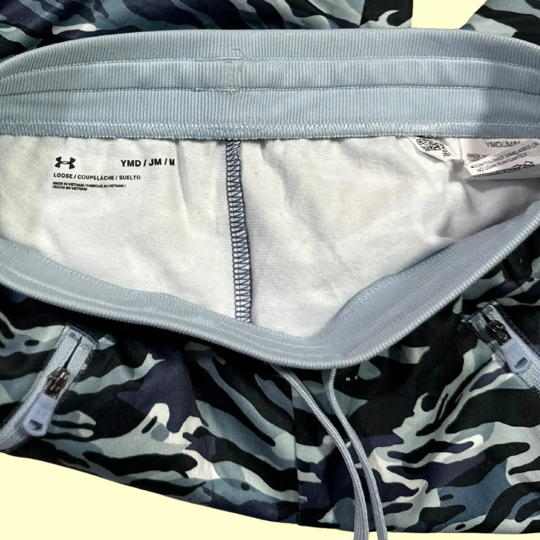 Under Armour® camo print performance shorts in a striking black, grey, and blue camouflage design