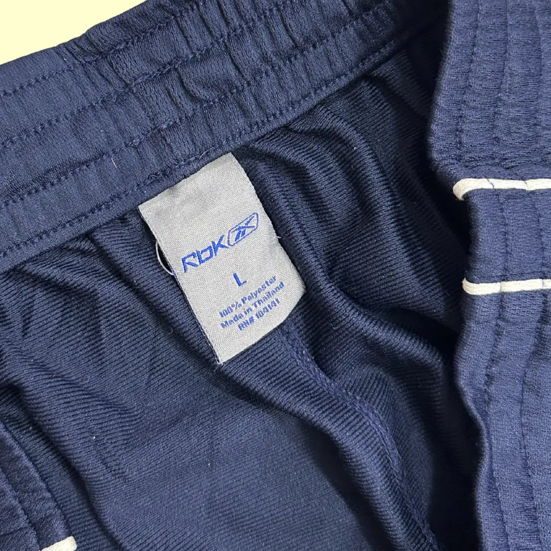 REEBOK  navy track pants are simple yet stylish with a sporty look