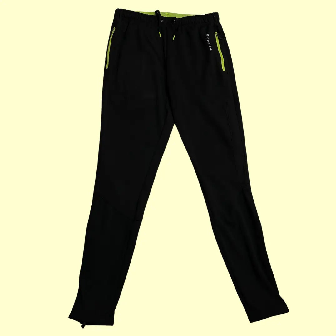 Kipsta black track pants are designed for comfort and performance.