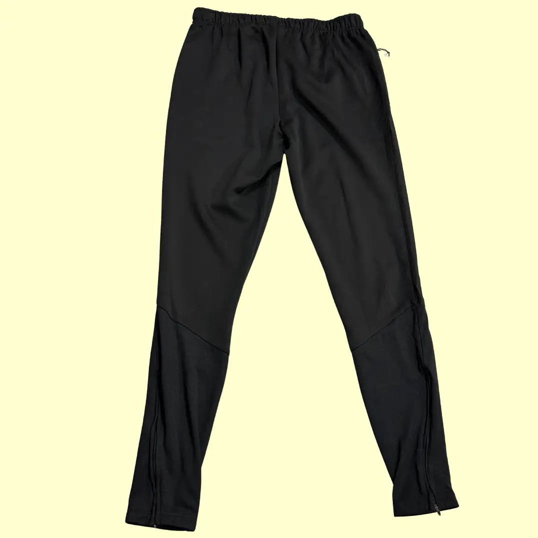 Kipsta black track pants are designed for comfort and performance.