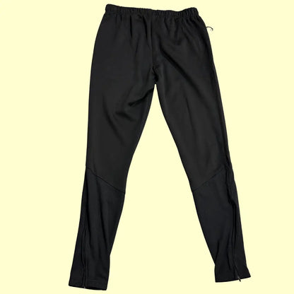 Kipsta black track pants are designed for comfort and performance.