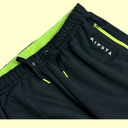 Kipsta black track pants are designed for comfort and performance.