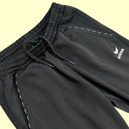 Erima black track pants are a sleek, versatile addition to any wardrobe