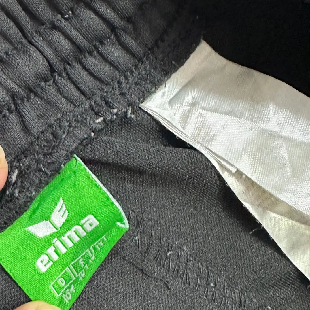 Erima black track pants are a sleek, versatile addition to any wardrobe