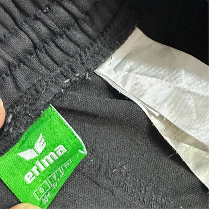 Erima black track pants are a sleek, versatile addition to any wardrobe