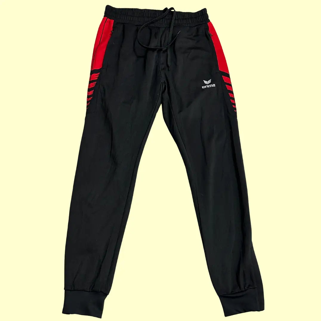 Erima Black Track Pants with striking red side panels and branding.