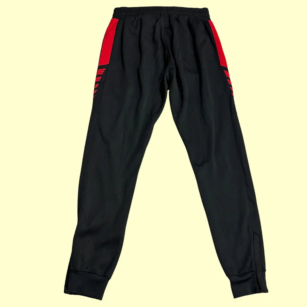 Erima Black Track Pants with striking red side panels and branding.