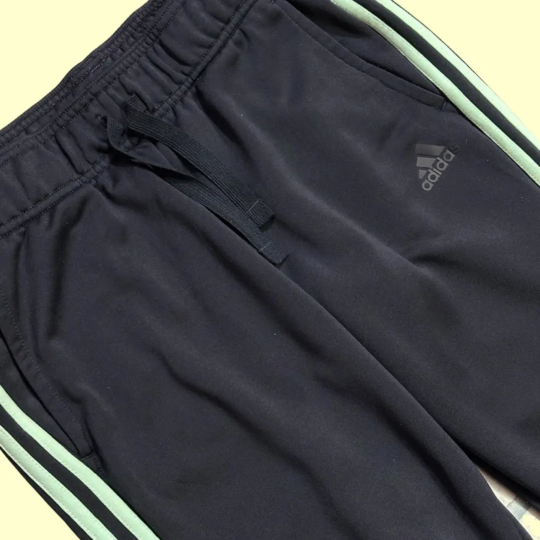 Adidas Black Jogging Pants with mint green side stripes and the signature Adidas logo