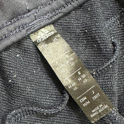 Adidas Black Jogging Pants with mint green side stripes and the signature Adidas logo