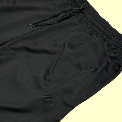 ACTIVE ®black jogging pants with white side stripes are perfect for both activewear and casual outings.