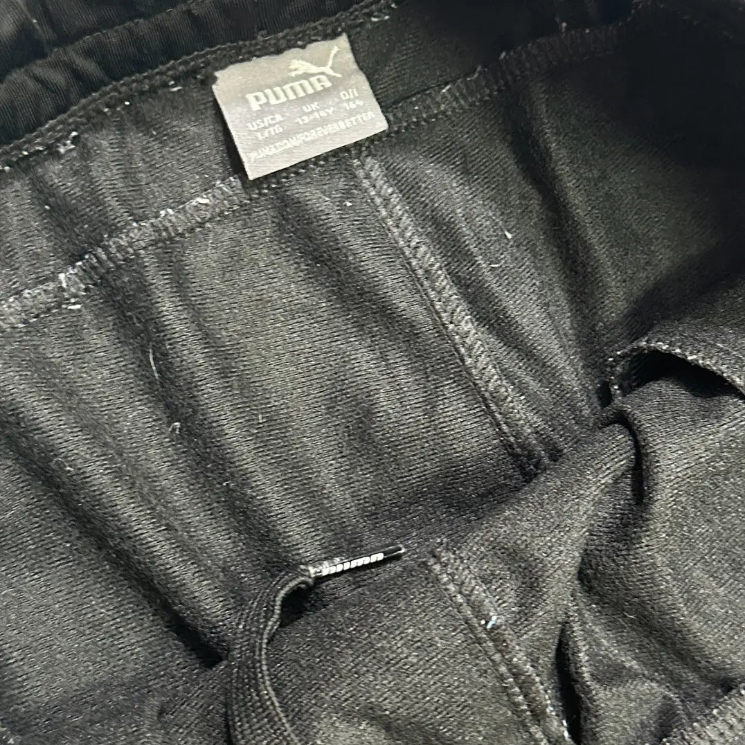 black Puma track pants are made from high-quality