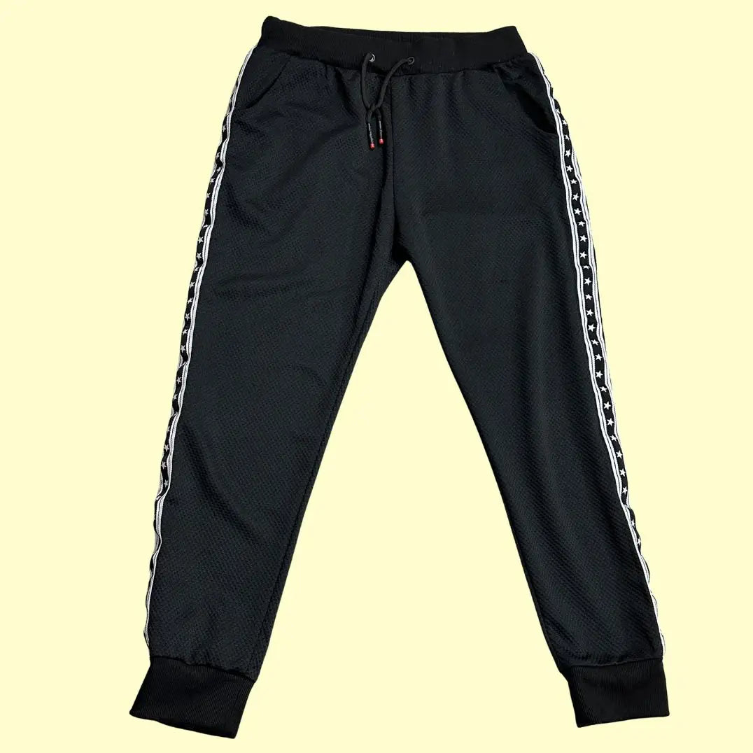 TYPHOON black mesh track pants offer a modern and comfortable design