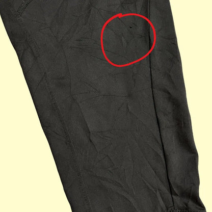 Nike track pants are designed with a bold red stripe along the sides