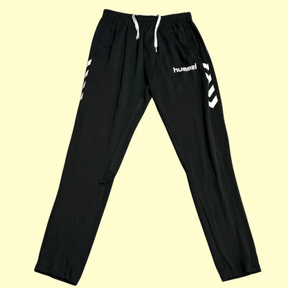 Hummel track pants feature stylish white chevron stripes along the sides