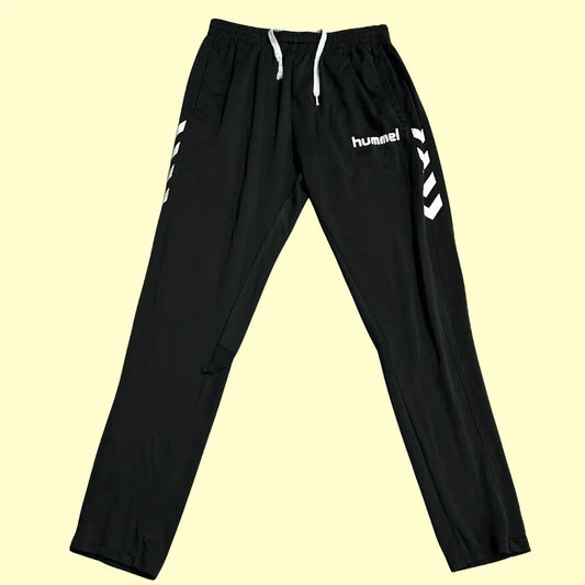 Hummel track pants feature stylish white chevron stripes along the sides