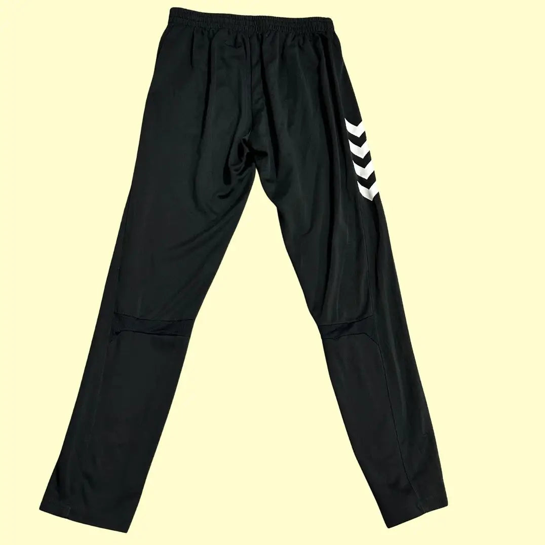 Hummel track pants feature stylish white chevron stripes along the sides