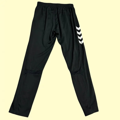 Hummel track pants feature stylish white chevron stripes along the sides