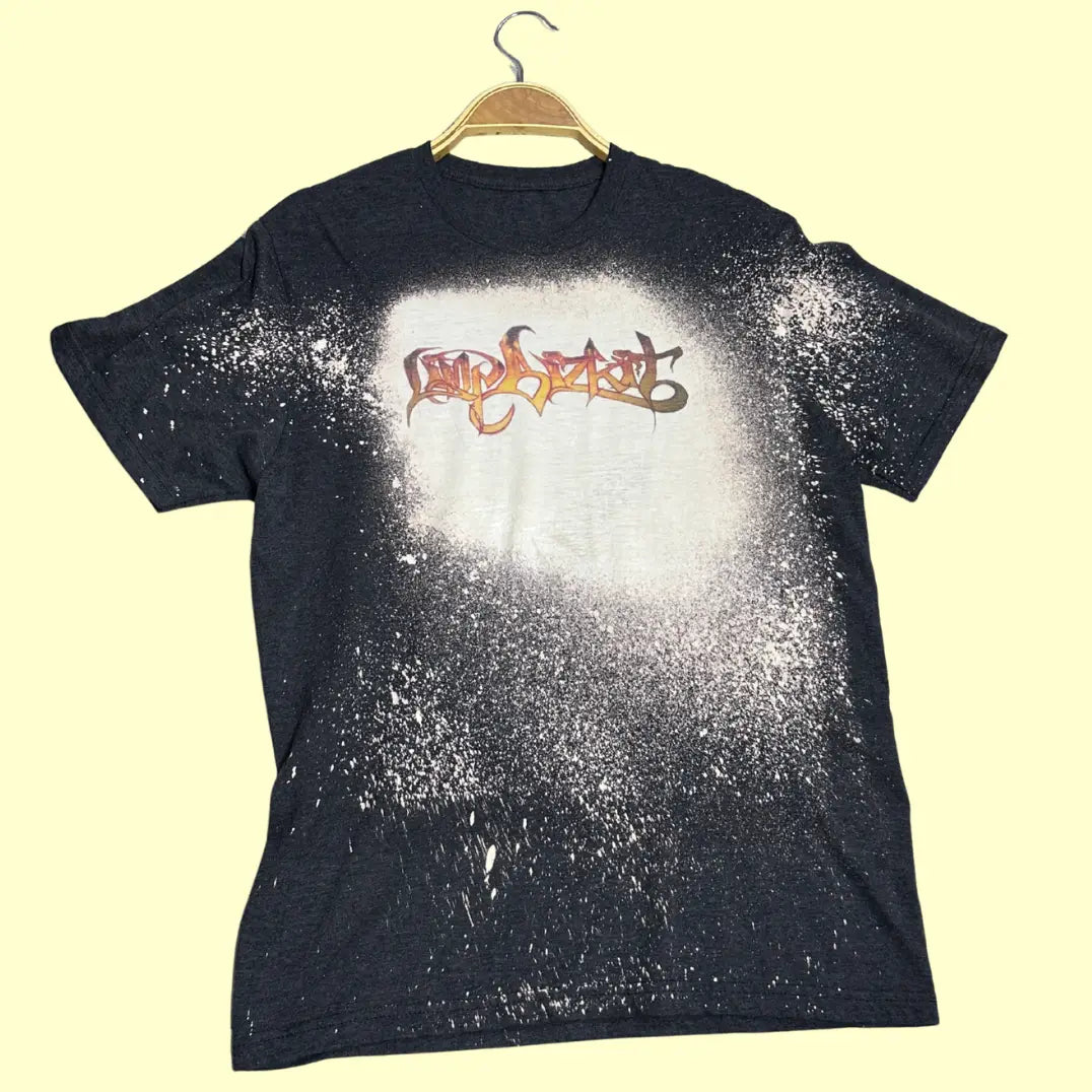 A trendy charcoal black T-shirt with a unique bleach-splatter effect