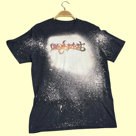 A trendy charcoal black T-shirt with a unique bleach-splatter effect