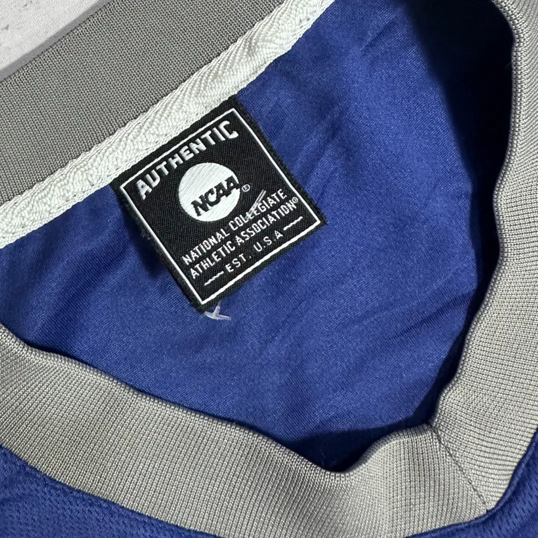 Authentic NCAA football jersey in deep royal blue with bold #17 print on the front and back