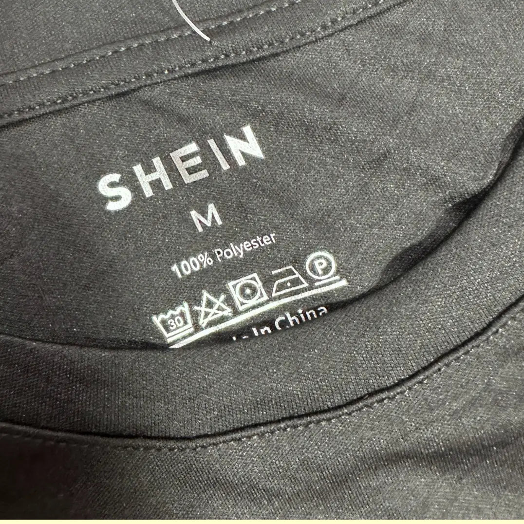 black Shein t-shirt made from 100% polyester