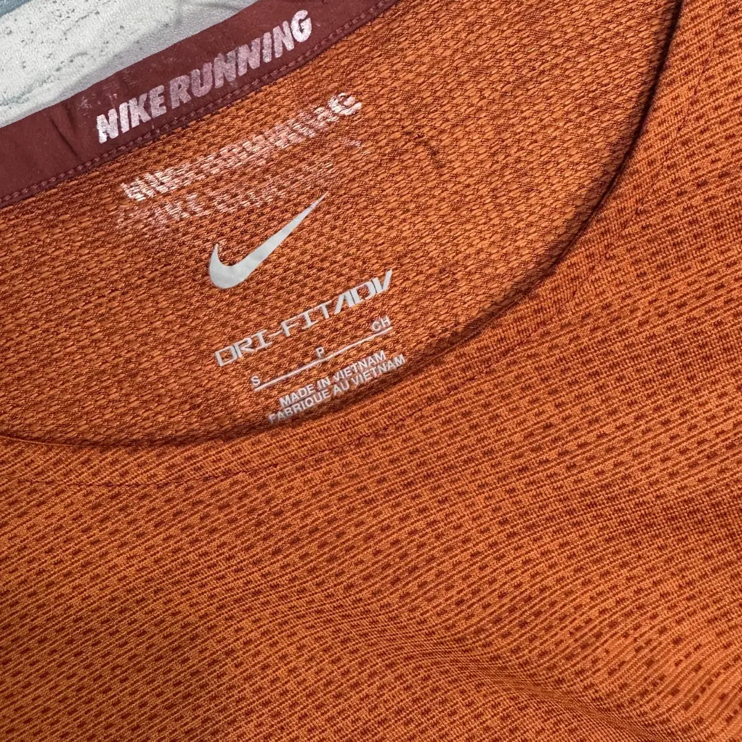 Nike Running Dri-FIT ADV t-shirt in burnt orange.